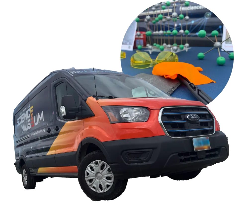 STEM Response Unit Van Image. Van is wrapped with FMSM logo on the side with a red to yellow gradient across the hood and onto the sides of the van. There is also a circular photo set behind it with items from a salt molecule activity.