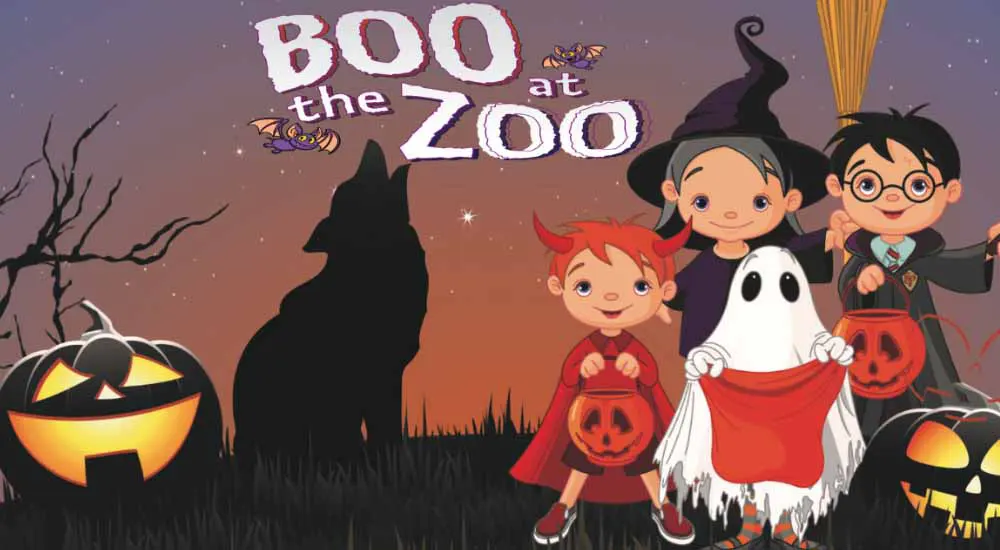 Boo at the Zoo text with silhouette of a wolf howling at the moon, as well as children dressed in costumes of a ghost, little red devil, and a witch, all holding trick or treat bags.
