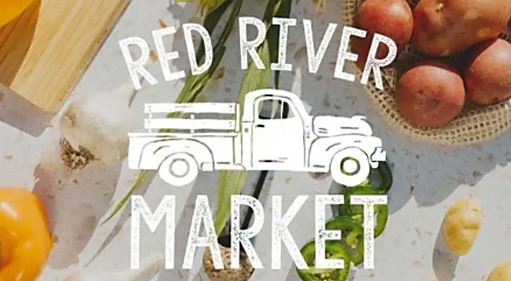 Red River Market logo with truck and vegetables in the background